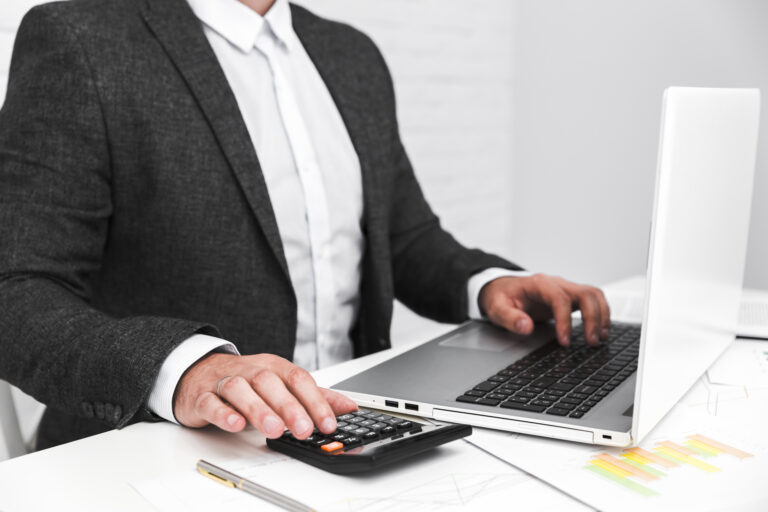 business-man-working-office-desktop-scaled.jpg